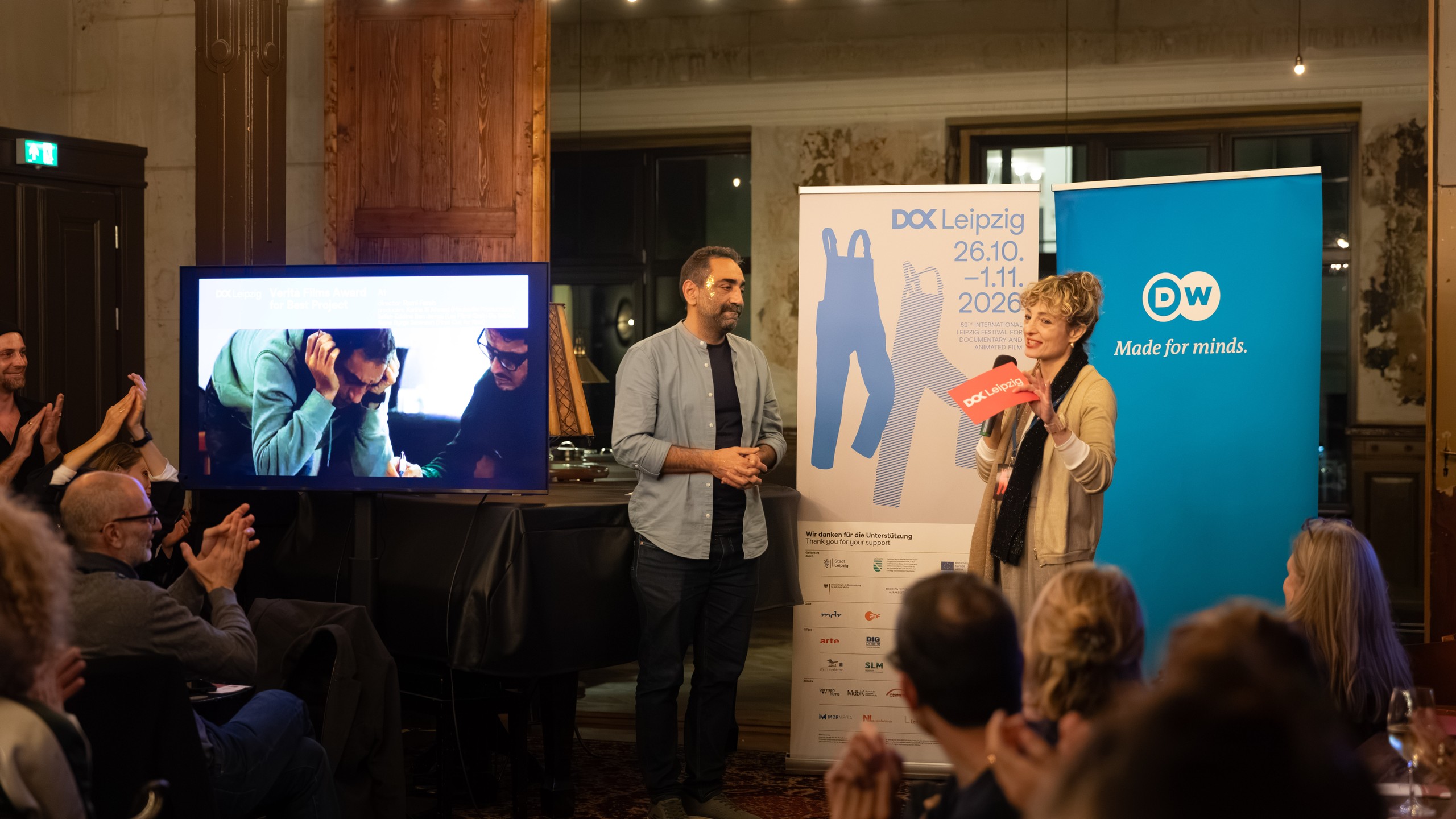Rami Farah and Jasmina Vignjevic of Verità Films on stage at the DOK Co-Pro Market awards in Leipzig