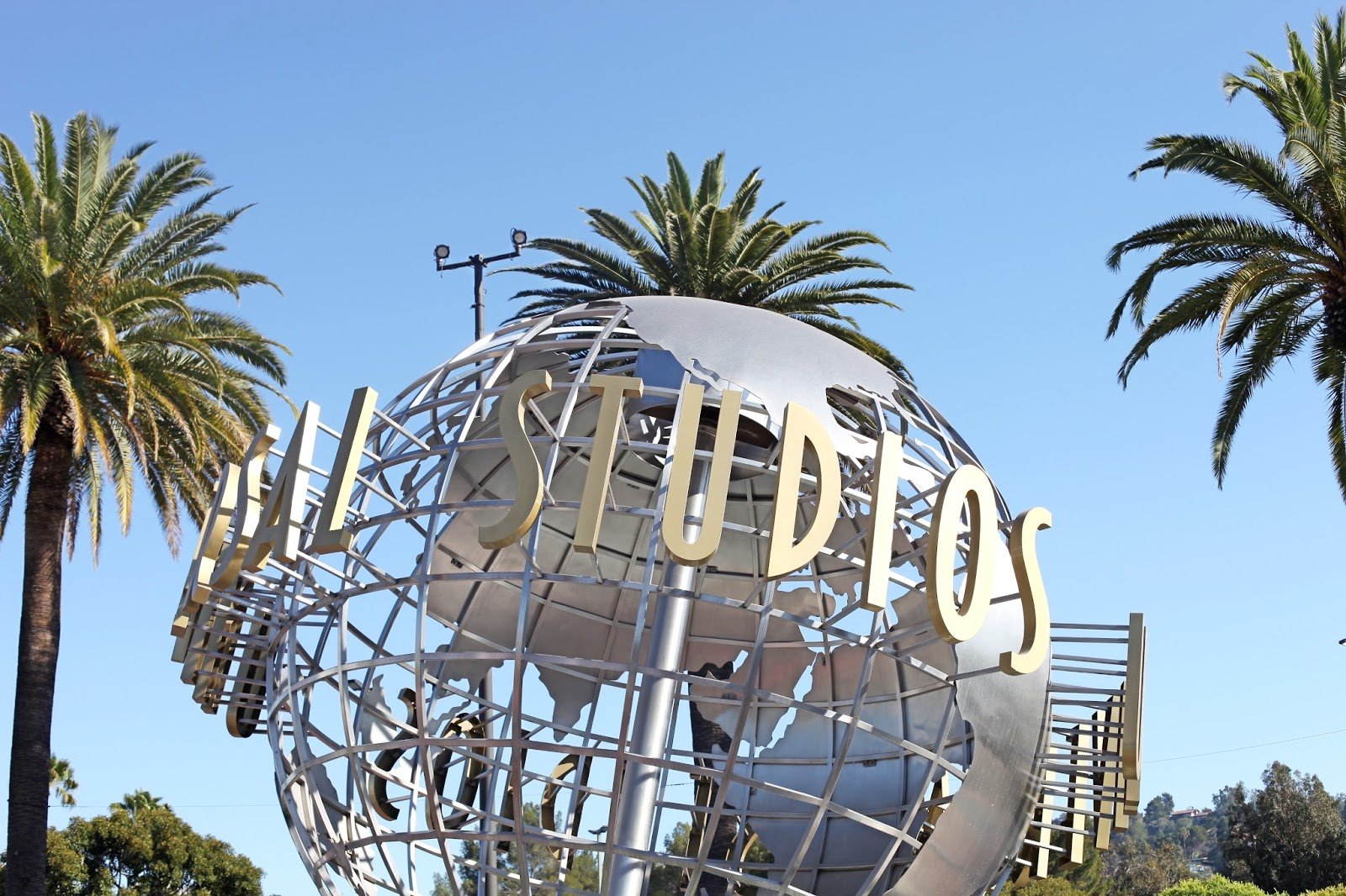 Universal Studios globe sculpture in Hollywood under a blue sky